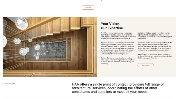 Modern timber staircase with feature lighting in contemporary UK residential architecture project.