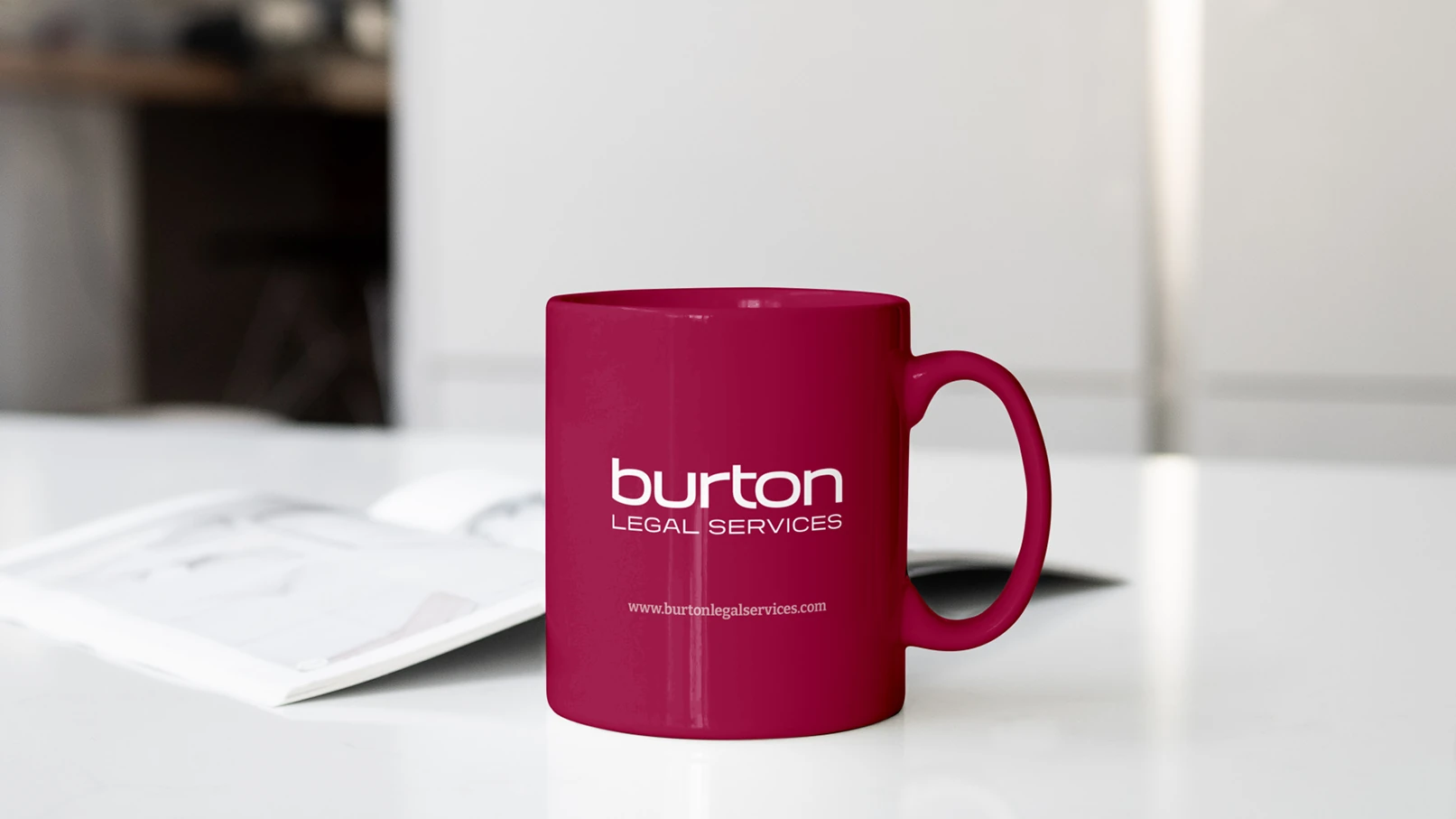 Burton Legal Services logo on red branded coffee mug