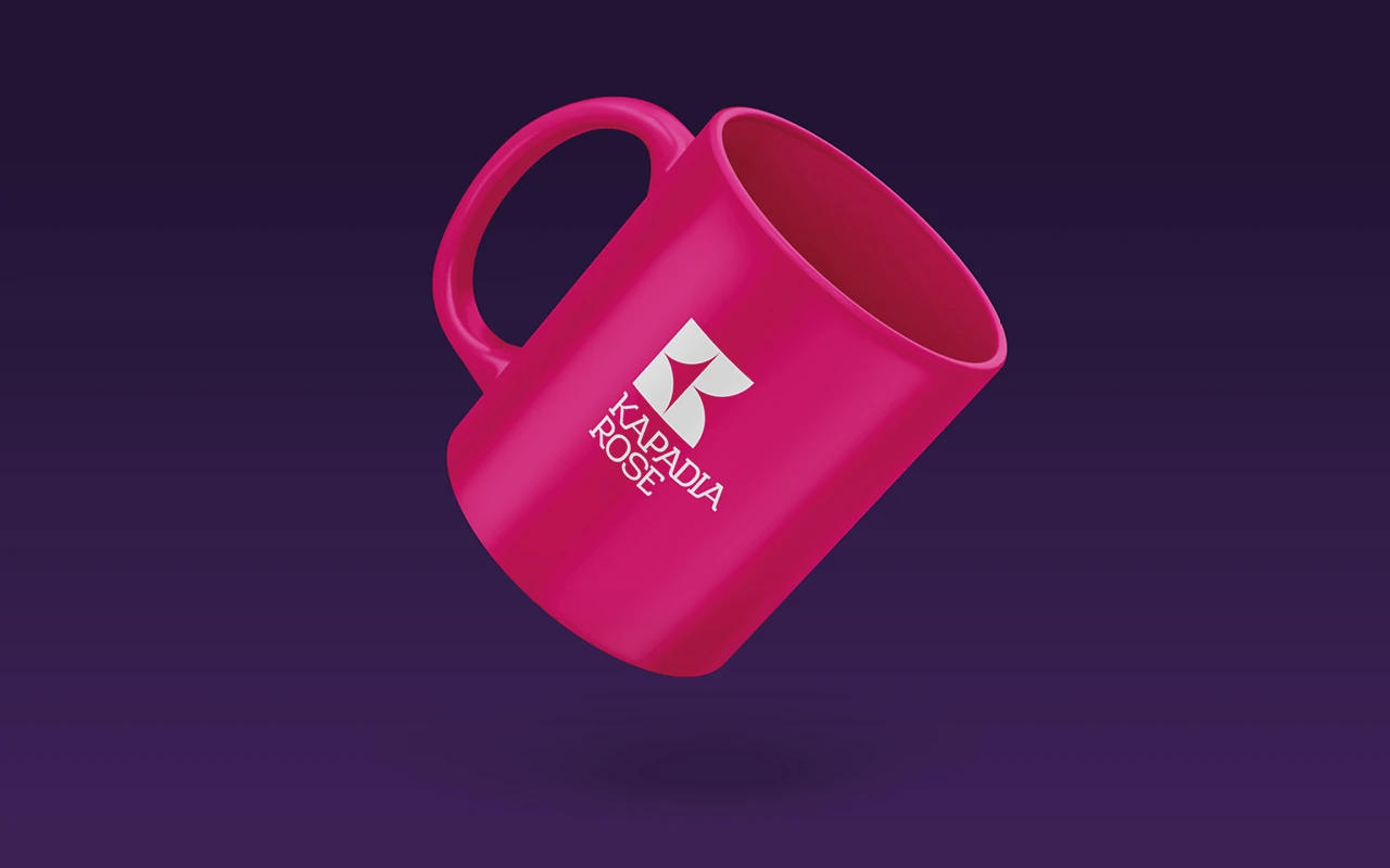 Kapadia Rose logo printed on a branded mug.
