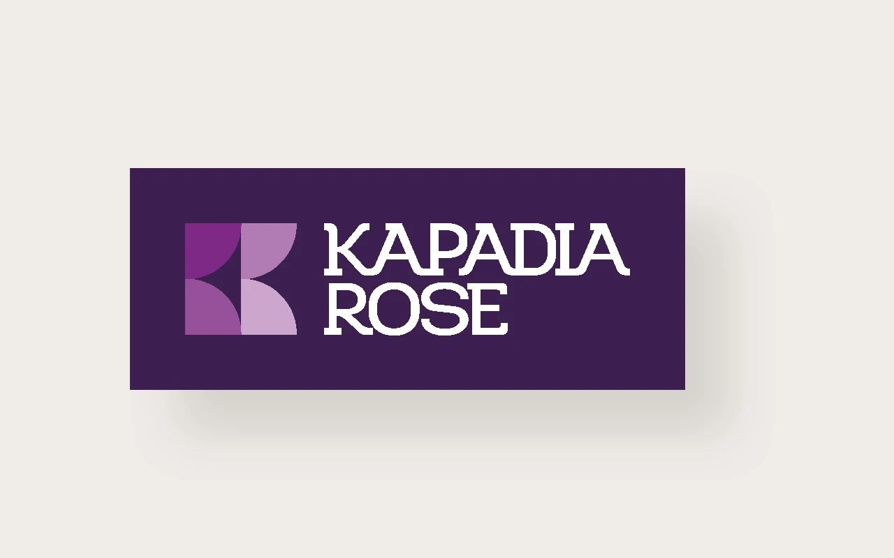 Kapadia Rose logo on a dark banner-style background