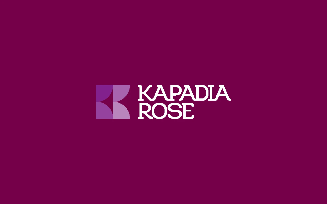 Kapadia Rose logo displayed on a deep maroon background