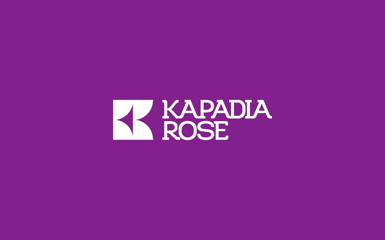 Kapadia Rose logo displayed in white on a purple background