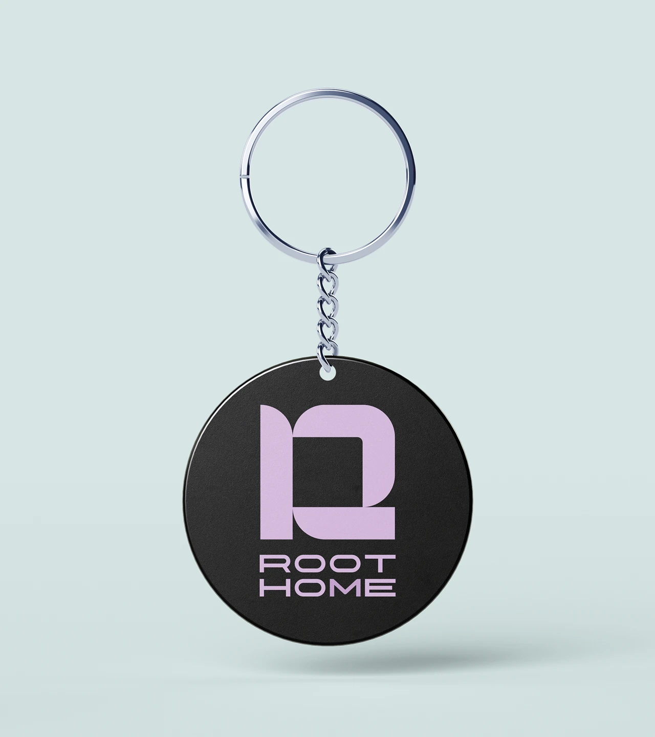 Root Home real estate investment branded keyring featuring geometric R logo